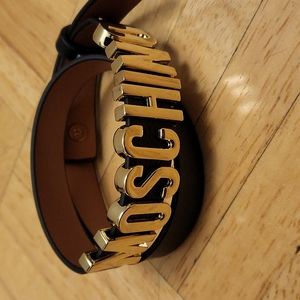 Black bracelet with gold lettering